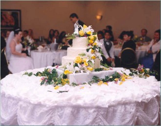 Traditional wedding cake in white with yellow flowers