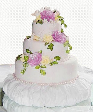 wedding cake with fresh flowers in pin and yellow