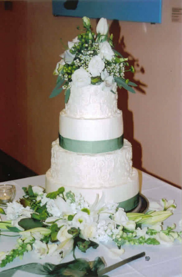 weddig cake with green ribbon