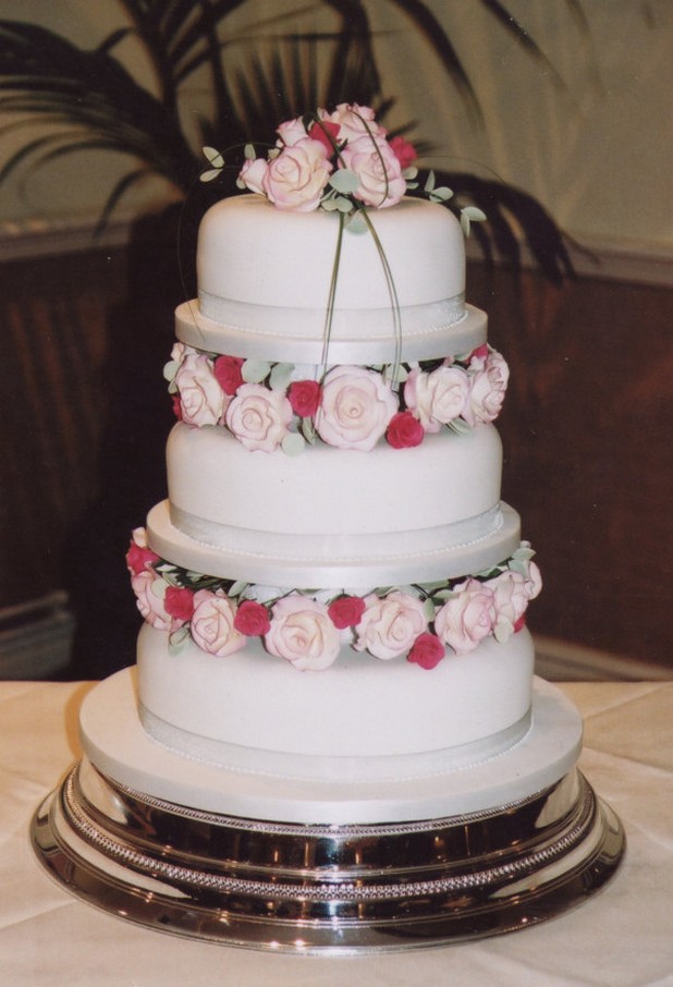 three tier wedding cake with two color roses picture