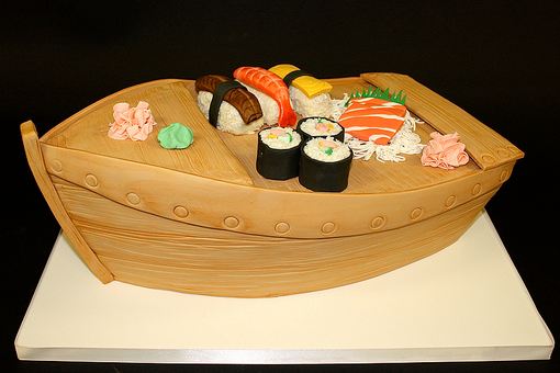 Sushi on a boat cake with wasabi and pickled ginger.JPG