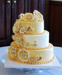 3 tier orange-yellow cake + flowers with diamonds inside.JPG