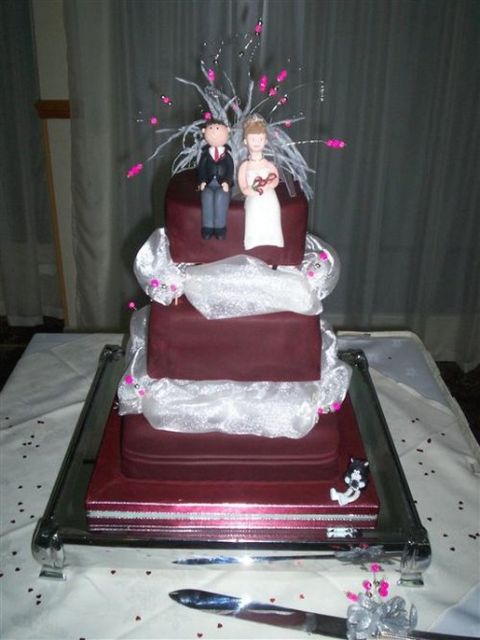 Dark chocolate wedding cake with status topper