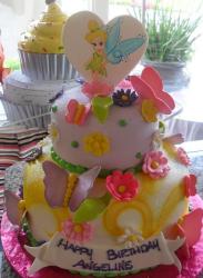 Two tier fairy and butterfly theme birthday cake.JPG