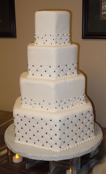 4 tier hexagon shape white wedding cake with diamond patterns.JPG