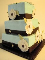 Three tier light blue square butter cream cake with white flowers.JPG