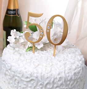 Photo of golden anniversary cake toppers.PNG