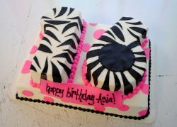 Sweet 16 birthday cake in the shape of the number 16 and zebra stripes and pink pearls.JPG