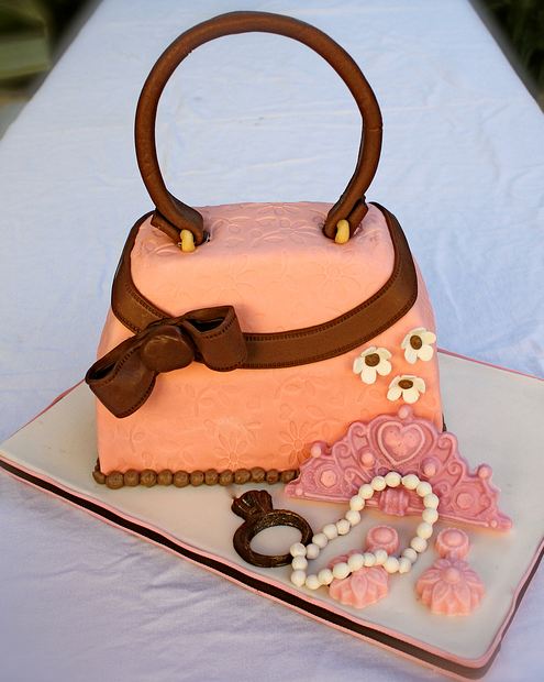 Orange handbag cake with pearl necklace.JPG