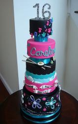 Five tier Sweet 16 birthday cake for girl who likes sushi, music, beach and Gucci.JPG