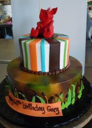 Two tier 60th birthday cake with red pig on top.JPG