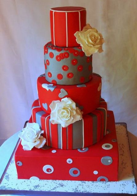 Five tier red round wedding cake with square base with white roses.JPG
