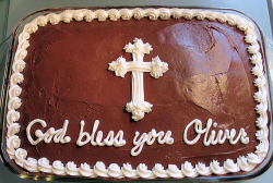 Chocolate baptism cake with white cross cake decor.PNG