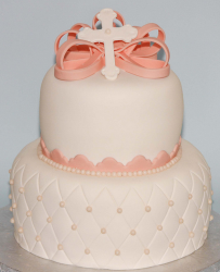 Two tiers baptism cakes with peach color cake decor and cross topper.PNG