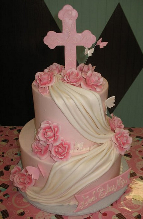 Two white and pink baptism cakes with big pink cross.PNG