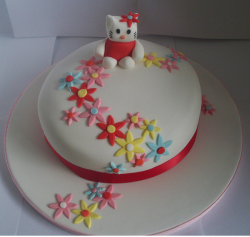 Modern Hello Kitty cake with flowers.PNG