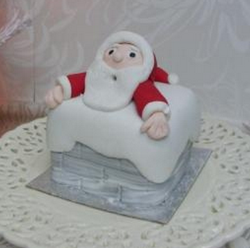 Holiday cake with Santa stucks in a chimney.PNG