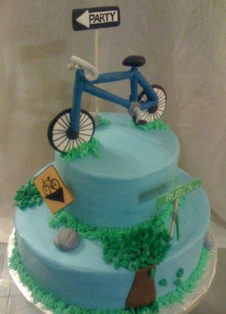 2 tier blue round biking theme cake.JPG