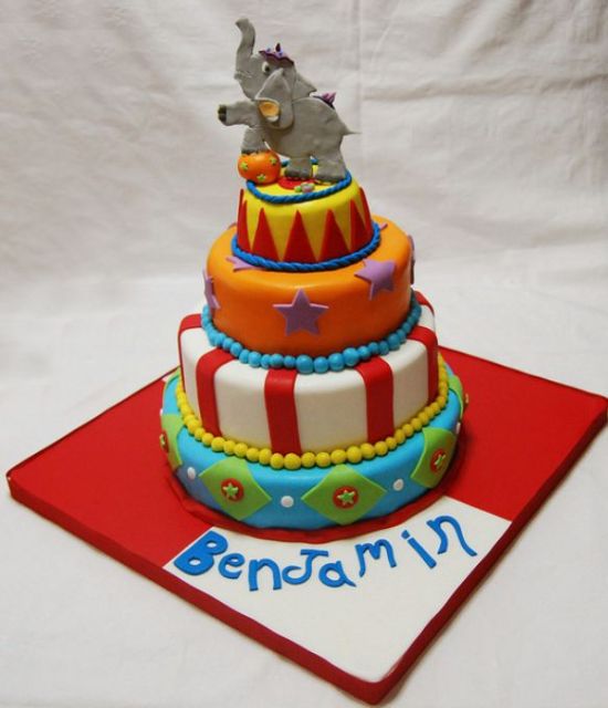 Four tier circus theme birthday cake with performing elephant on top.JPG
