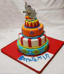 Four tier circus theme birthday cake with performing elephant on top.JPG