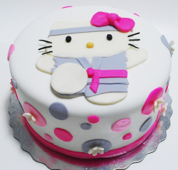 Cute karate hello kitty cakes with grey and bright pink cake decors.PNG