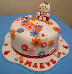 Floral Hello Kitty Cakes with Hello Kitty cake topper.PNG