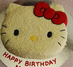 Hello Kitty face birthday cake in creamy white.PNG