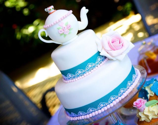 Three tier cake with tea kettle on top and pink roses.JPG