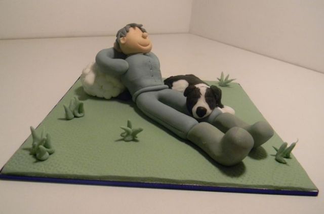 Relaxing in the grassfield with dog cake.JPG
