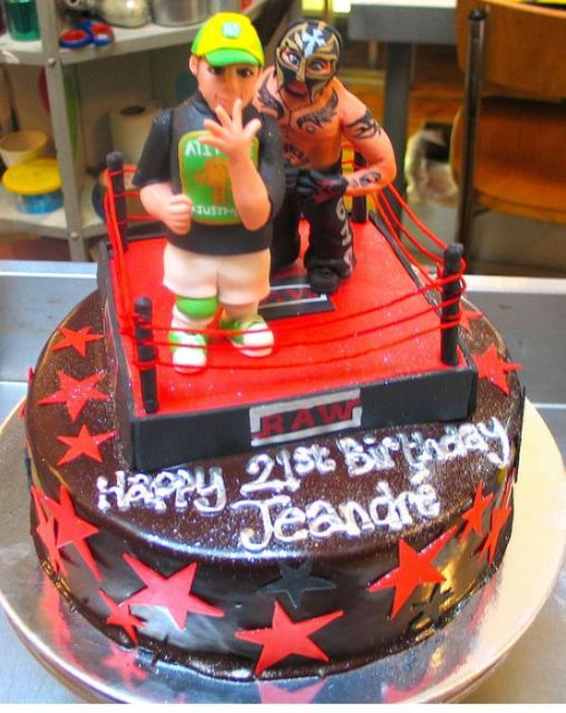 Wrestling WWE theme chocolate birthday cake with ring and wrestlers.JPG