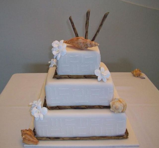 3 tier white square wedding cake with conch shells.JPG