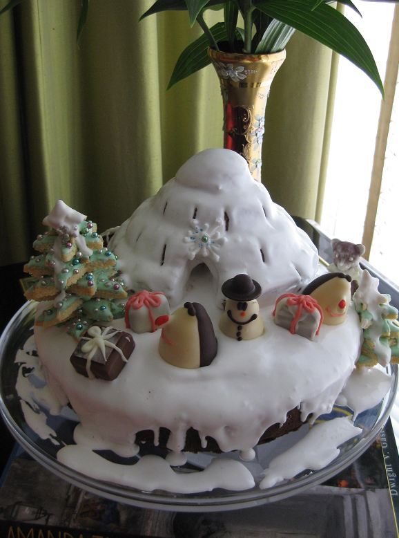 Christmas theme cake with igloo and snowman and cookie tree.JPG