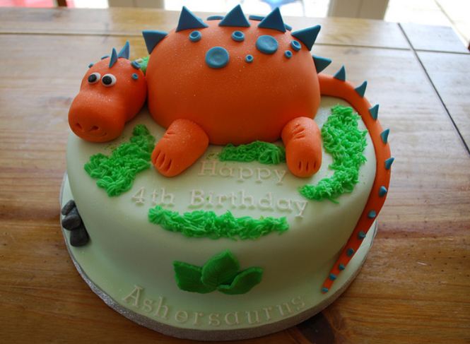 Orange dinosaur round birthday cake for 4-year-old.JPG