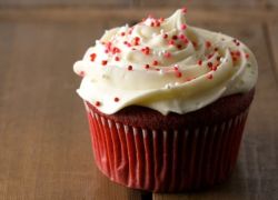 Red velvet cupcake with white cream on top.JPG