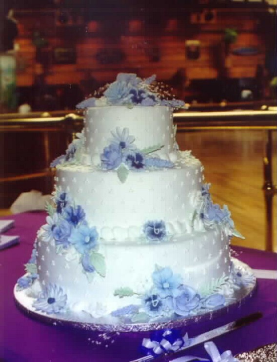 white wedding cakes with blue flowers image