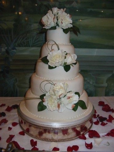 white wedding cake with white flowers picture