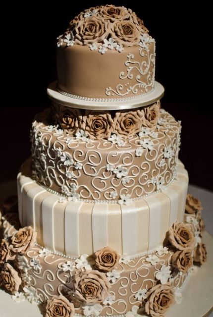4 tier elegant round chocolate wedding cake with chocolate roses.JPG