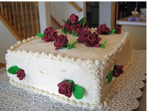 photo of bridal shower cake with dark red roses.jpg