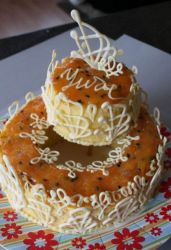 Two tier mini butter cake with white chocolate decor.JPG