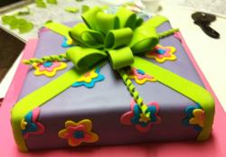 Lavender gift box cake with green bow.JPG