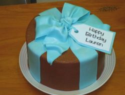 Chocolate birthday cake with cyan gift bow.jpg