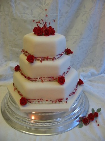 wedding cake with red roses