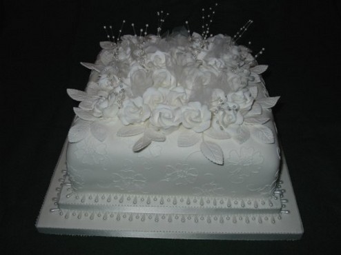 square white wedding cake with white flowers