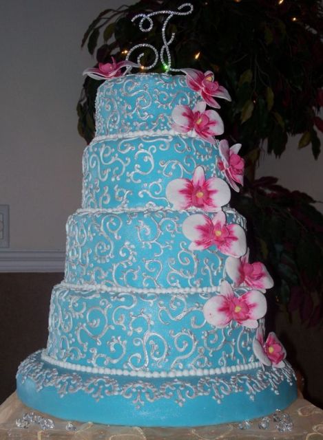 Blue wedding cake with orchids.JPG