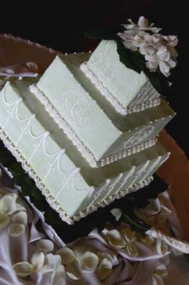 Square wedding cake with flowers on top
