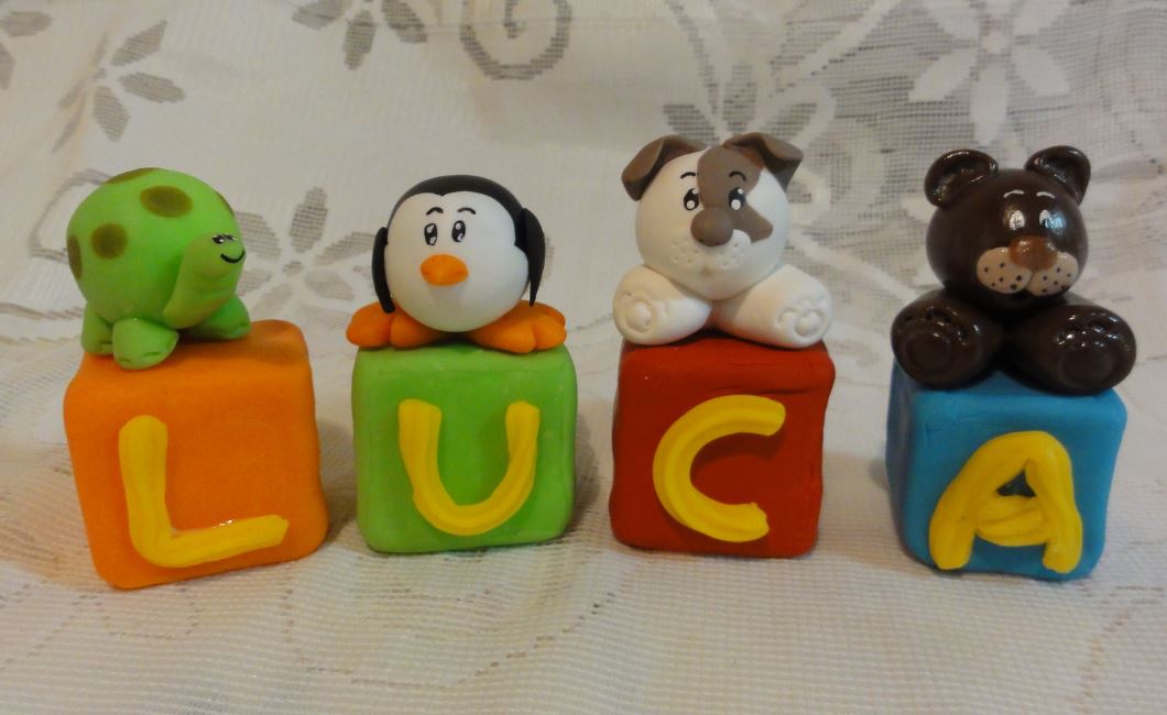 Mini alphabet block cakes with animals on top.JPG