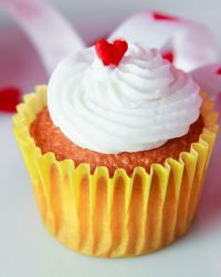 Valentine theme cupcake with white cream and red heart on top.JPG